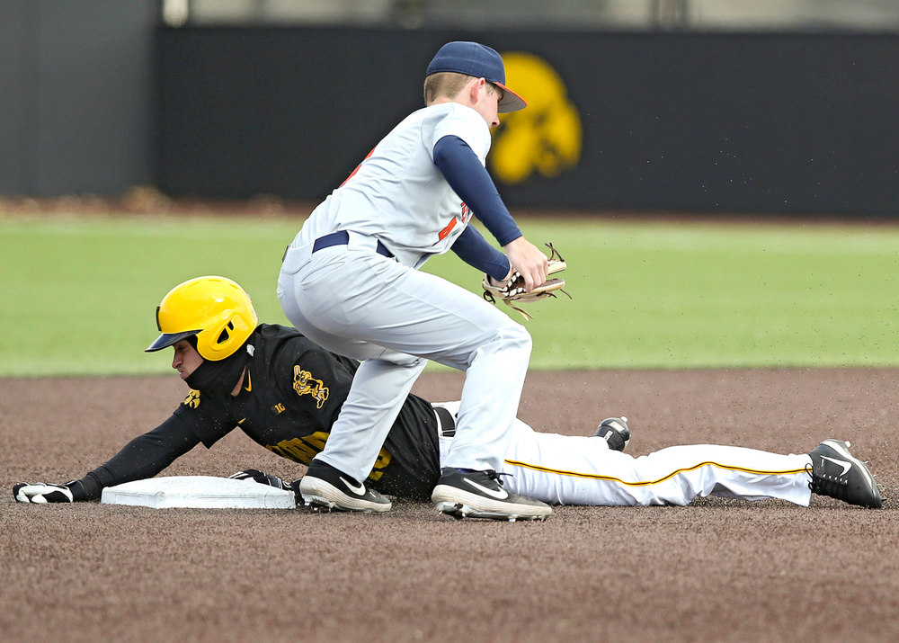 Iowa Hawkeyes shortstop Tanner Wetrich (16) steals second base during the sixth inning of their game against Illinois at Duane Banks Field in Iowa City on Saturday, Mar. 30, 2019. (Stephen Mally/hawkeyesports.com)