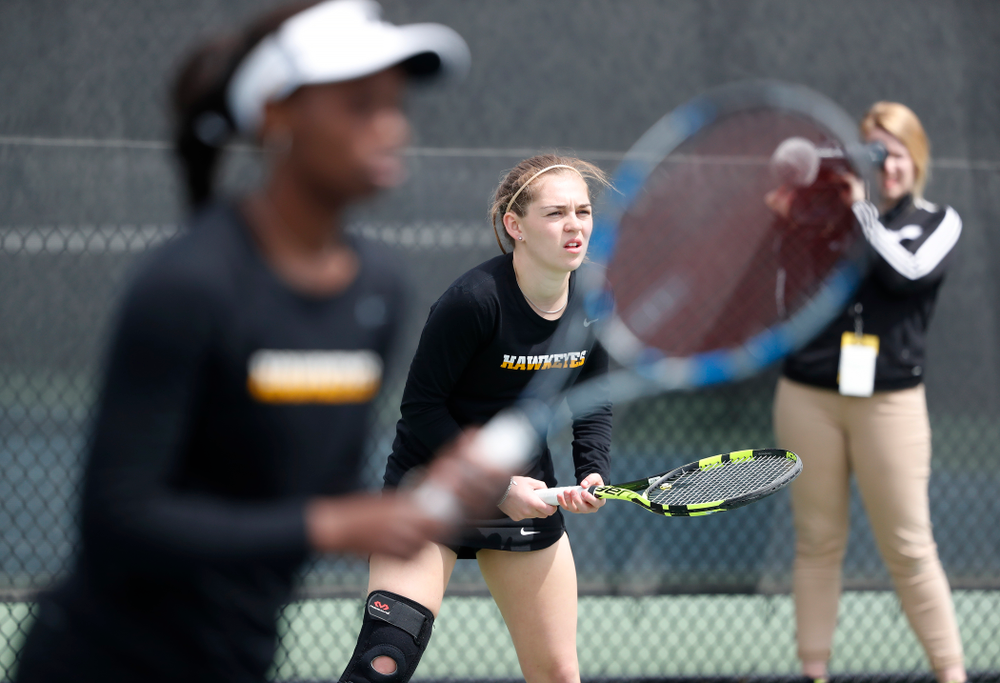 Adorabol Huckleby and Zoe Douglas play a doubles match against the Wisconsin Badgers Sunday, April 22, 2018 at the Hawkeye Tennis and Recreation Center. (Brian Ray/hawkeyesports.com)