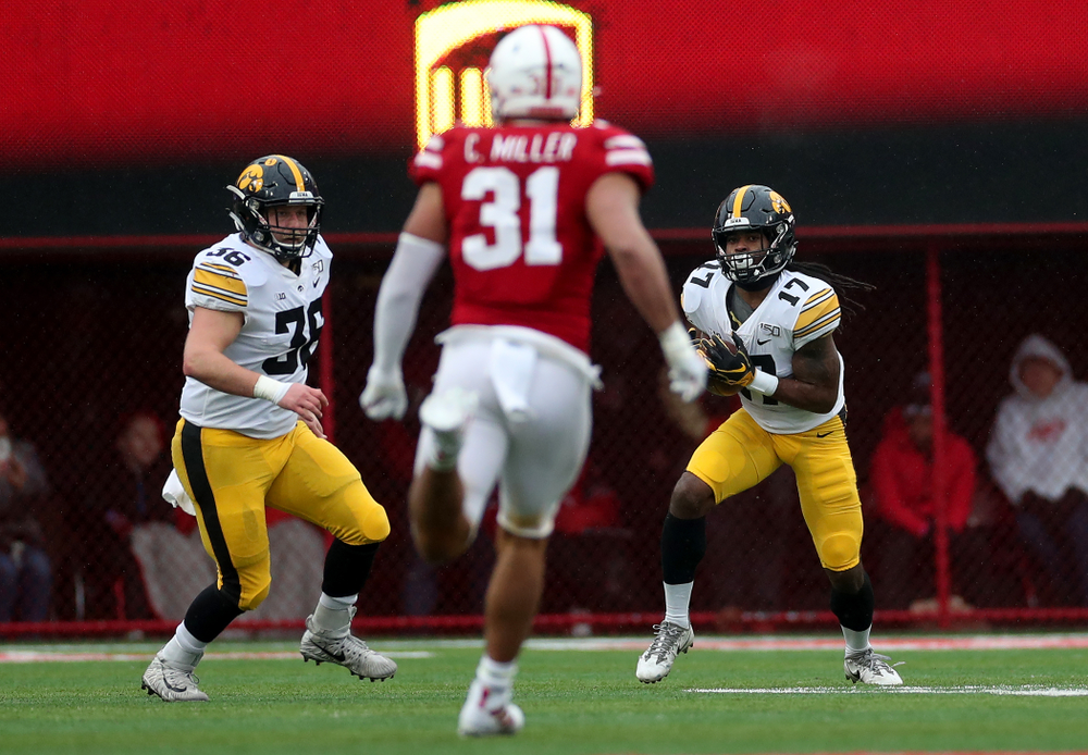Iowa Hawkeyes fullback Brady Ross (36) and defensive back Devonte Young (17) against the Nebraska Cornhuskers Friday, November 29, 2019 at Memorial Stadium in Lincoln, Neb. (Brian Ray/hawkeyesports.com)