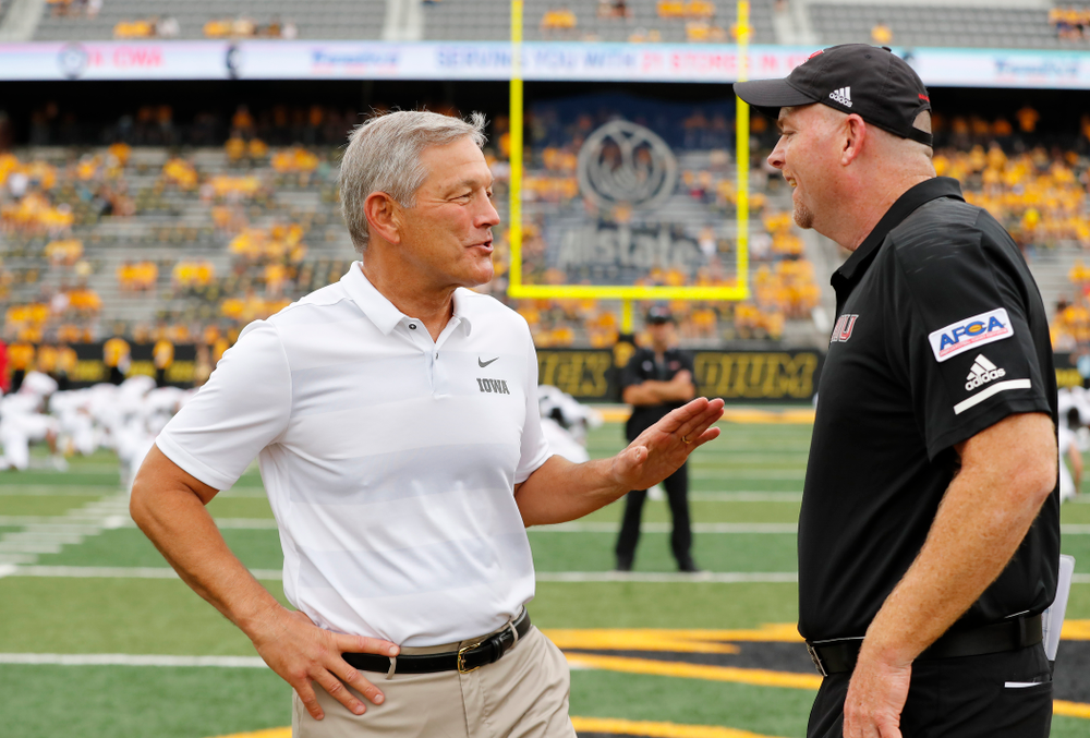 Iowa Hawkeyes head coach Kirk Ferentz shakes hands with head coach Rod Carey Saturday, September 1, 2018 at Kinnick Stadium. (Brian Ray/hawkeyesports.com)