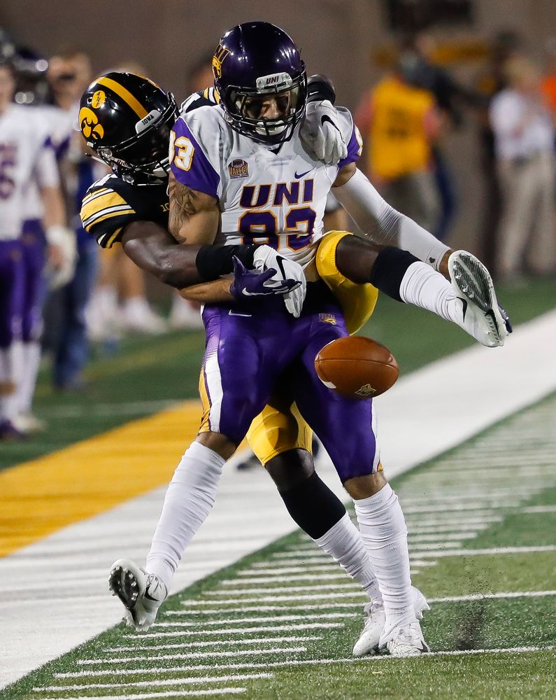 Iowa Hawkeyes defensive back Michael Ojemudia (11) breaks up a pass during a game against Northern Iowa at Kinnick Stadium on September 15, 2018. (Tork Mason/hawkeyesports.com)