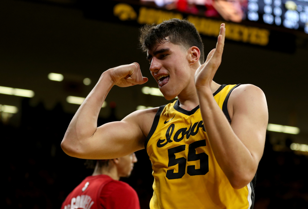Iowa Hawkeyes forward Luka Garza (55) flexes after making a basket and drawing a foul against the Rutgers Scarlet Knights Wednesday, January 22, 2020 at Carver-Hawkeye Arena. (Brian Ray/hawkeyesports.com)