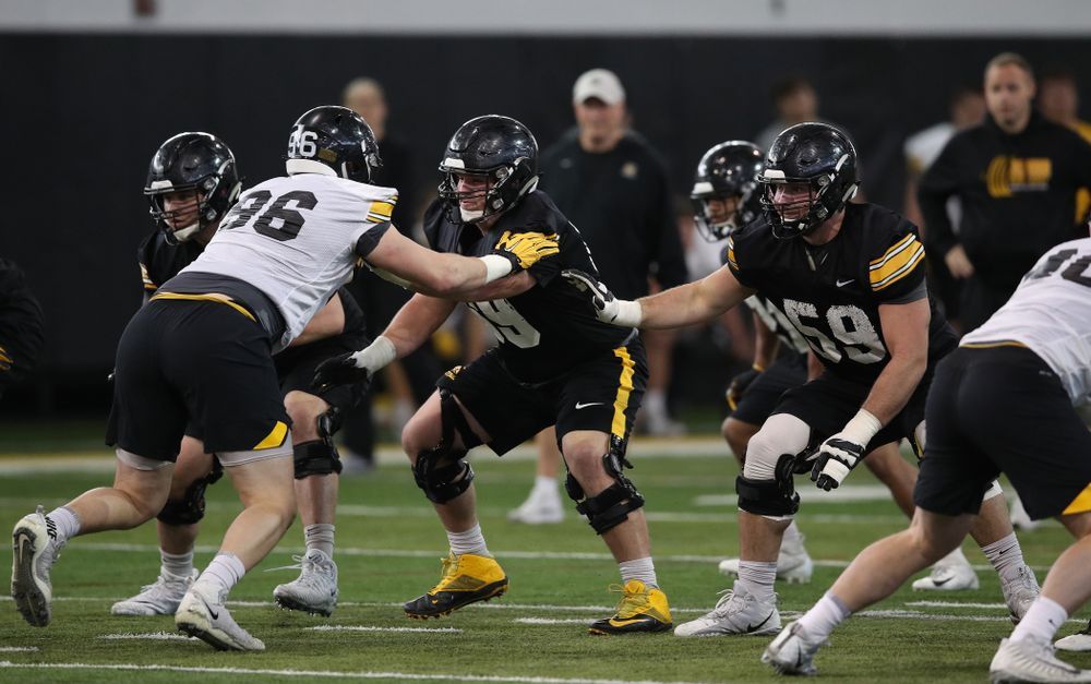 Iowa Hawkeyes offensive lineman Keegan Render (69) and offensive lineman Ross Reynolds (59) during preparation for the 2019 Outback Bowl Tuesday, December 18, 2018 at the Hansen Football Performance Center. (Brian Ray/hawkeyesports.com)