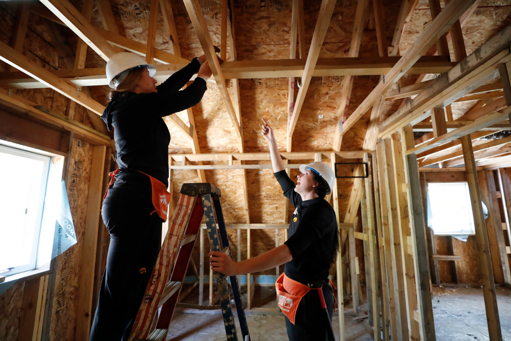 Iowa Hawkeyes forward Megan Gustafson (10) and Iowa Hawkeyes forward/center Monika Czinano (25) work on the Habitat for Humanity Women's Build Wednesday, September 26, 2018 in Iowa City. (Brian Ray/hawkeyesports.com)