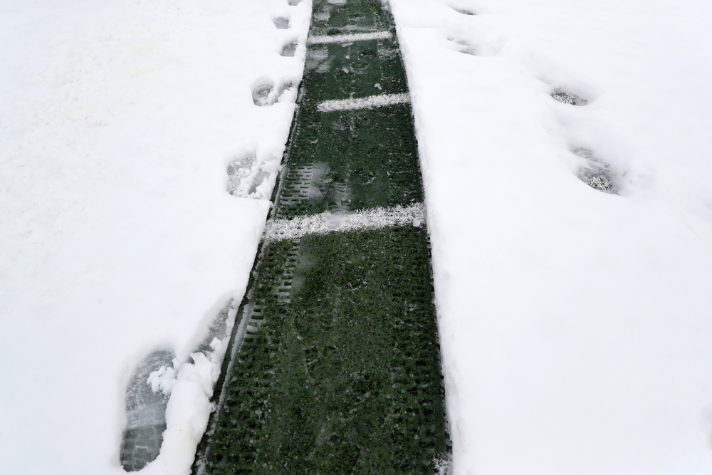 Members of the Iowa Athletics Turf Management staff create the #SnowWave for kids in the Stead Family Children's Hospital Thursday, February