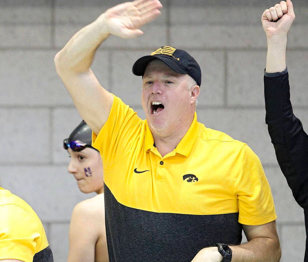 Iowa assistant coach Emma Sougstad (from left), assistant coach/women’s recruiting coordinator Sarah Stockwell-Gregson, and assistant coach/men’s recruiting coordinator Brian Schrader urge on Lauren McDougall (not pictured) as she swims the women’s 500 yard freestyle preliminary event during the 2020 Women’s Big Ten Swimming and Diving Championships at the Campus Recreation and Wellness Center in Iowa City on Thursday, February 20, 2020. (Stephen Mally/hawkeyesports.com)