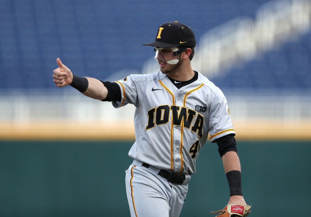Iowa Hawkeyes Tanner Wetrich (16) and infielder Mitchell Boe (4) celebrate after tuning a double play against the Indiana Hoosiers in the first round of the Big Ten Baseball Tournament Wednesday, May 22, 2019 at TD Ameritrade Park in Omaha, Neb. (Brian Ray/hawkeyesports.com)
