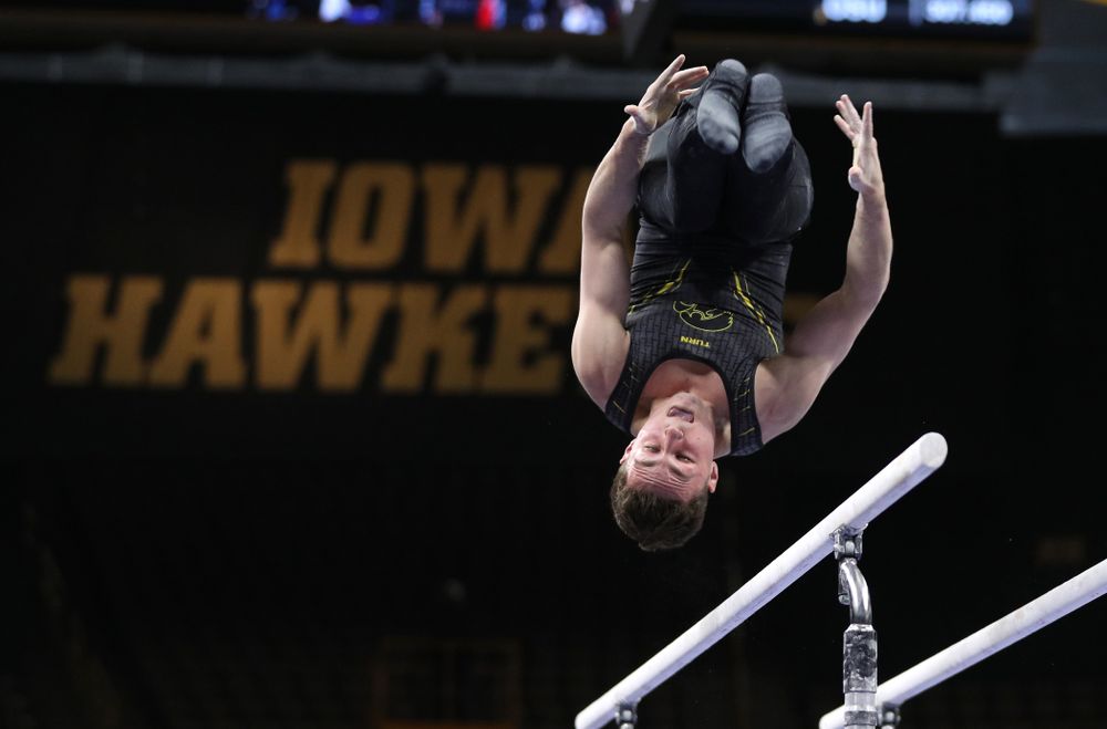 Iowa's Jake Brodarzon competes on the parallel bars against the Ohio State Buckeyes Saturday, March 16, 2019 at Carver-Hawkeye Arena. (Brian Ray/hawkeyesports.com)