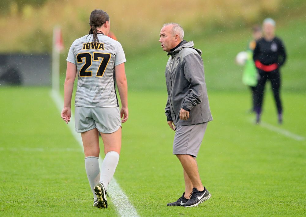 Iowa forward Samantha Tawharu (27) talks with head coach Dave DiIanni during the second half of their match at the Iowa Soccer Complex in Iowa City on Sunday, Sep 29, 2019. (Stephen Mally/hawkeyesports.com)