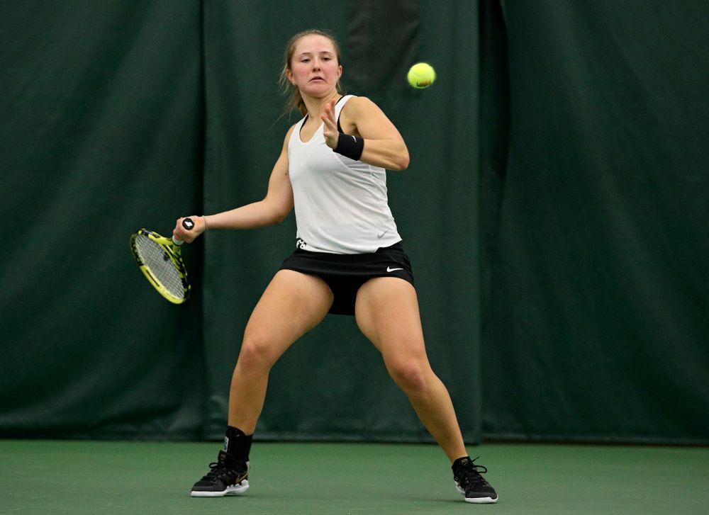 Iowa’s Danielle Burich returns a shot during her singles match at the Hawkeye Tennis and Recreation Complex in Iowa City on Sunday, February 23, 2020. (Stephen Mally/hawkeyesports.com)