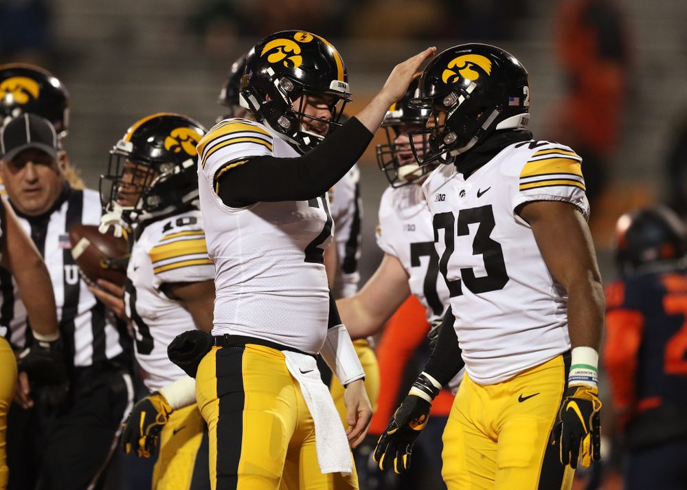 Iowa Hawkeyes quarterback Peyton Mansell (2) and wide receiver Dominique Dafney (23) against the Illinois Fighting Illini Saturday, November 17, 2018 at Memorial Stadium in Champaign, Ill. (Brian Ray/hawkeyesports.com)