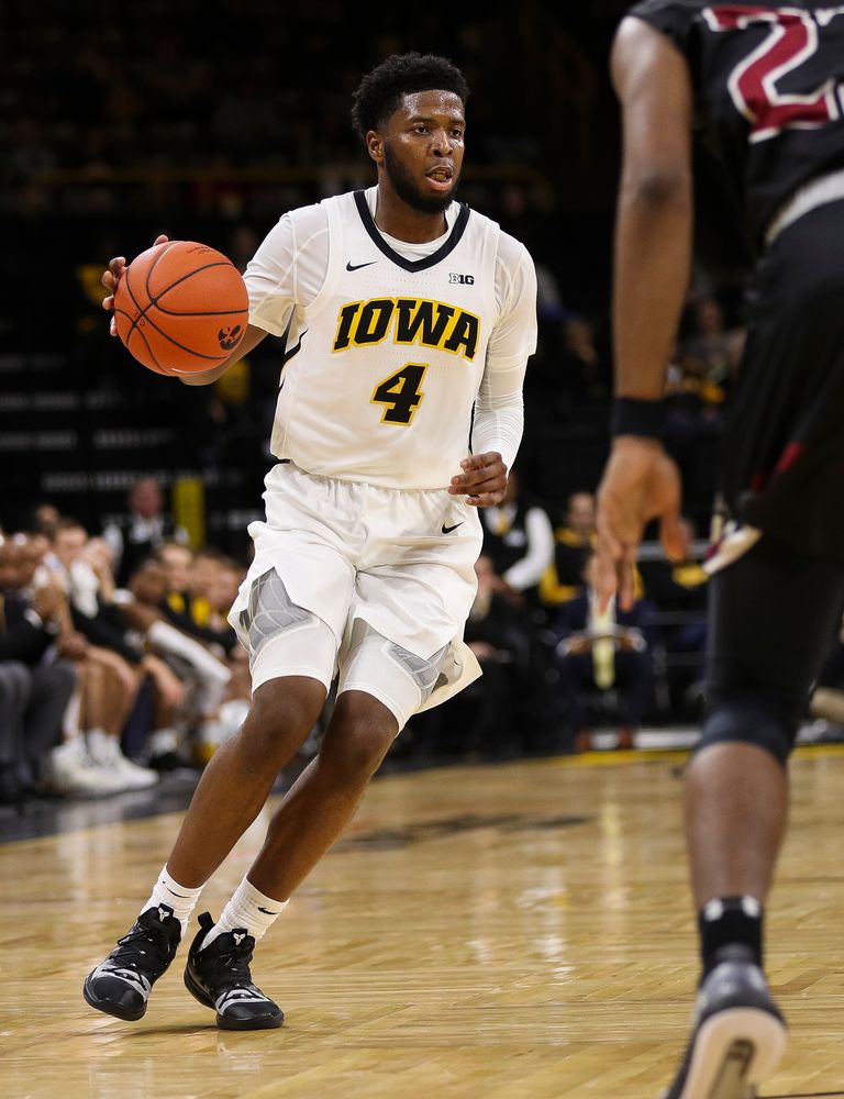 Iowa Hawkeyes guard Isaiah Moss (4) dribbles the ball up court during a game against Guilford College at Carver-Hawkeye Arena on November 4, 2018. (Tork Mason/hawkeyesports.com)
