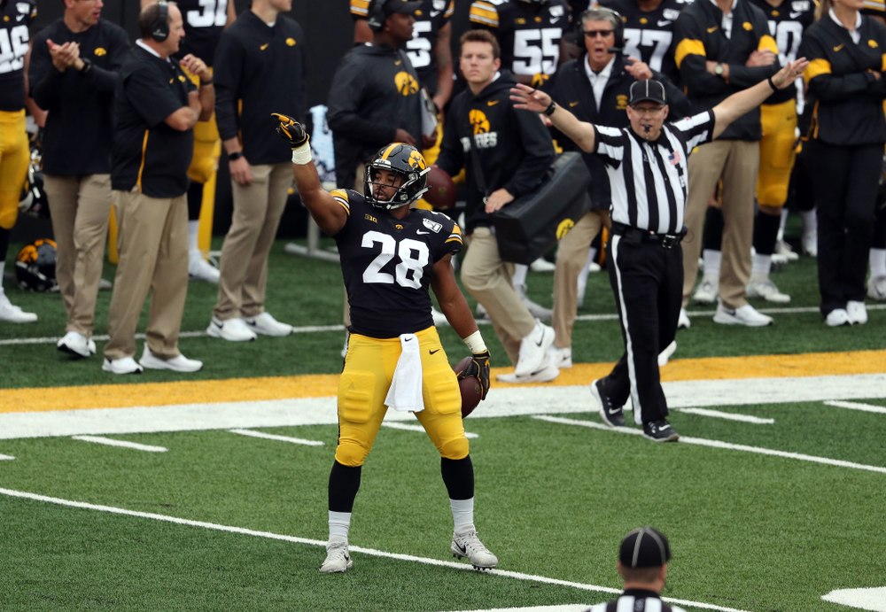 Iowa Hawkeyes running back Toren Young (28) signals for a first down against Middle Tennessee State Saturday, September 28, 2019 at Kinnick Stadium. (Brian Ray/hawkeyesports.com)