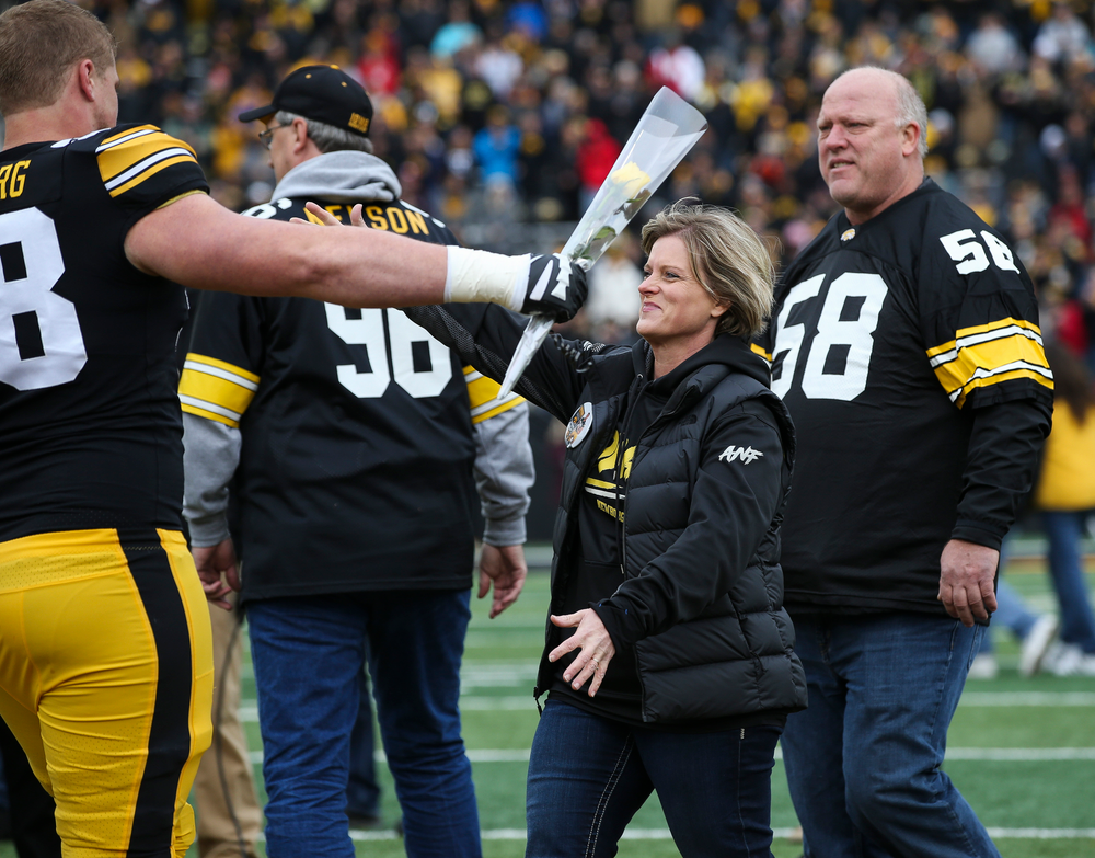 Iowa Hawkeyes offensive lineman Jake Newborg (58) is greeted by his parents during Senior Day ceremonies before a game against Nebraska at Kinnick Stadium on November 23, 2018. (Tork Mason/hawkeyesports.com)