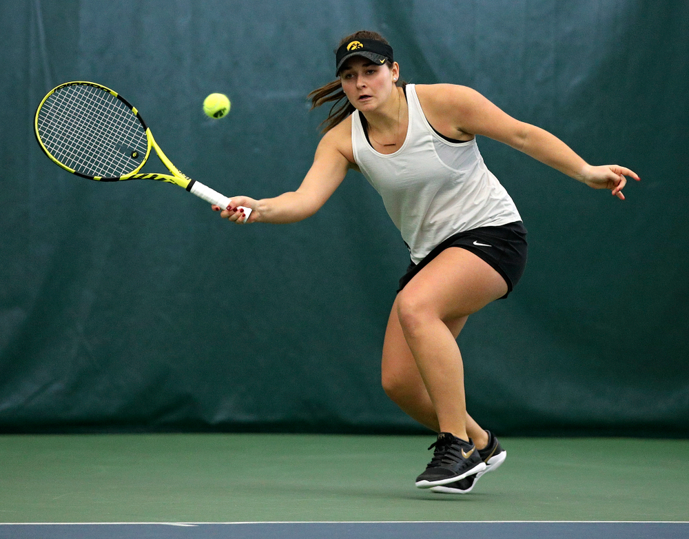 Iowa’s Danielle Bauers returns a shot during her doubles match at the Hawkeye Tennis and Recreation Complex in Iowa City on Sunday, February 23, 2020. (Stephen Mally/hawkeyesports.com)