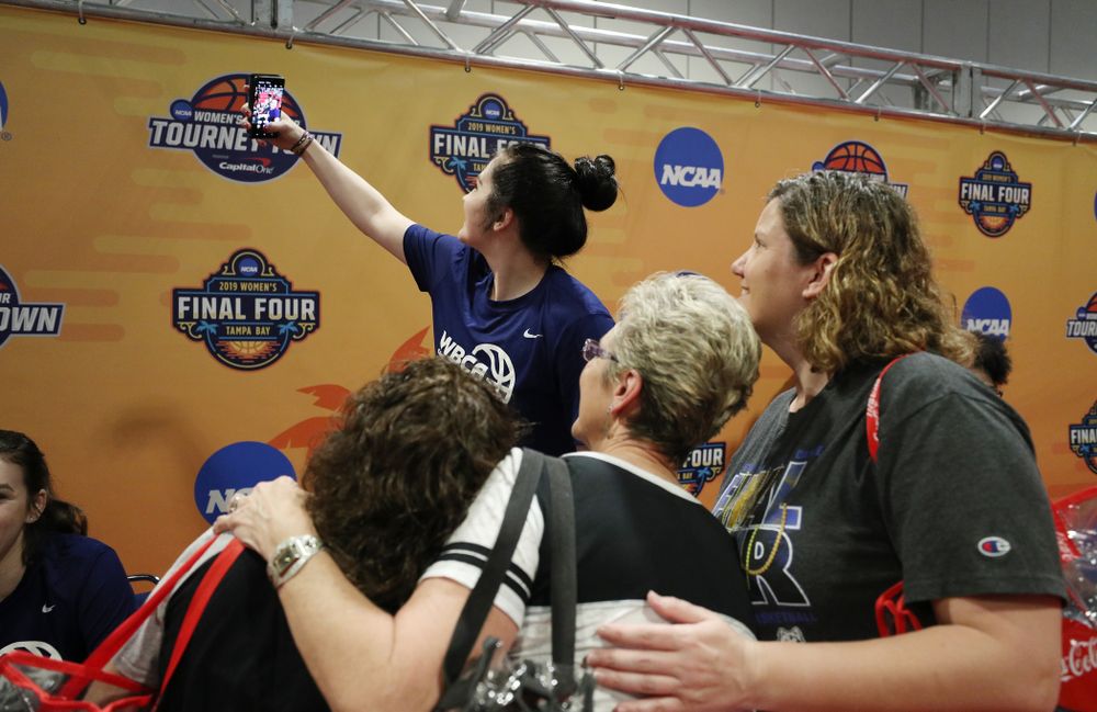 Iowa Hawkeyes forward Megan Gustafson (10) signs autographs with the other WBCA All Americans at the Tourney Town Fan Fest Friday, April 5, 2019 at the Tampa Convention Center in Tampa, FL. (Brian Ray/hawkeyesports.com)