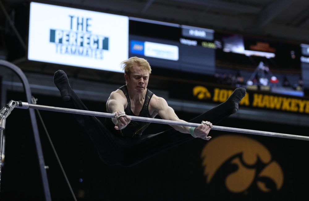 Iowa's Nick Merryman competes on the high bar against the Ohio State Buckeyes Saturday, March 16, 2019 at Carver-Hawkeye Arena. (Brian Ray/hawkeyesports.com)