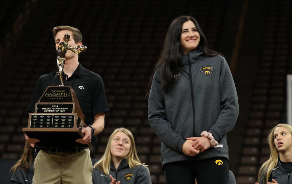 Iowa Hawkeyes forward Megan Gustafson (10) is presented with the Naismith Player Of The Year Trophy during the teamÕs Celebr-Eight event Wednesday, April 24, 2019 at Carver-Hawkeye Arena. (Brian Ray/hawkeyesports.com)