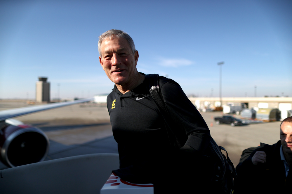 Iowa Hawkeyes head coach Kirk Ferentz boards the team plane at the Eastern Iowa Airport Saturday, December 21, 2019 on the way to San Diego, CA for the Holiday Bowl. (Brian Ray/hawkeyesports.com)