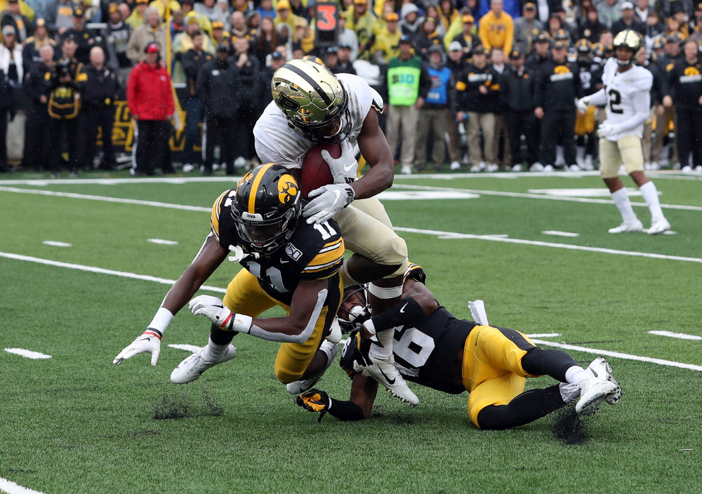 Iowa Hawkeyes defensive back Michael Ojemudia (11) and defensive back Terry Roberts (16) against the Purdue Boilermakers Saturday, October 19, 2019 at Kinnick Stadium. (Brian Ray/hawkeyesports.com)