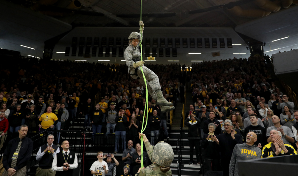Members of the Iowa Army and Air Force ROTC rappel down from the rafters before the Iowa Hawkeyes game against Penn State Saturday, February 29, 2020 at Carver-Hawkeye Arena. (Brian Ray/hawkeyesports.com)