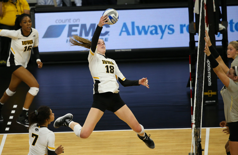 Iowa Hawkeyes middle blocker Hannah Clayton (18) spikes the ball during a game against Purdue at Carver-Hawkeye Arena on October 13, 2018. (Tork Mason/hawkeyesports.com)