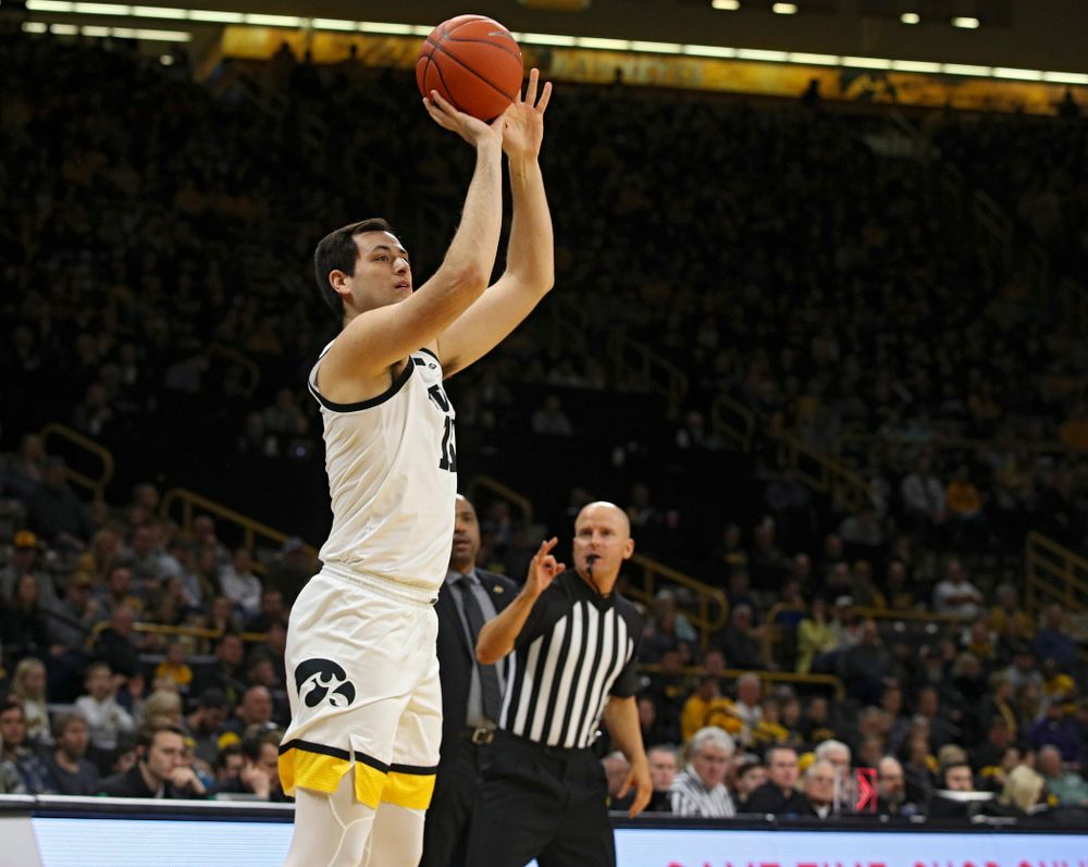 Iowa Hawkeyes forward Ryan Kriener (15) makes a 3-pointer during the first half of their their game at Carver-Hawkeye Arena in Iowa City on Sunday, December 29, 2019. (Stephen Mally/hawkeyesports.com)