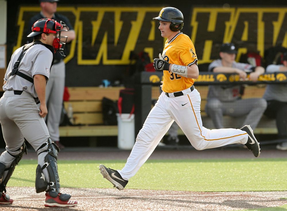 Iowa Hawkeyes catcher Brett McCleary (32) scores a run during the fourth inning of their game against Northern Illinois at Duane Banks Field in Iowa City on Tuesday, Apr. 16, 2019. (Stephen Mally/hawkeyesports.com)