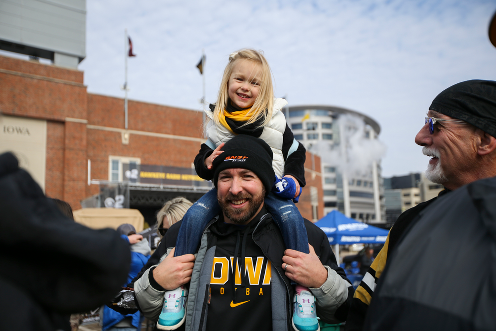 Iowa fans smile for a photo during Iowa football vs Minnesota on Saturday, November 16, 2019 at Kinnick Stadium. (Lily Smith/hawkeyesports.com)