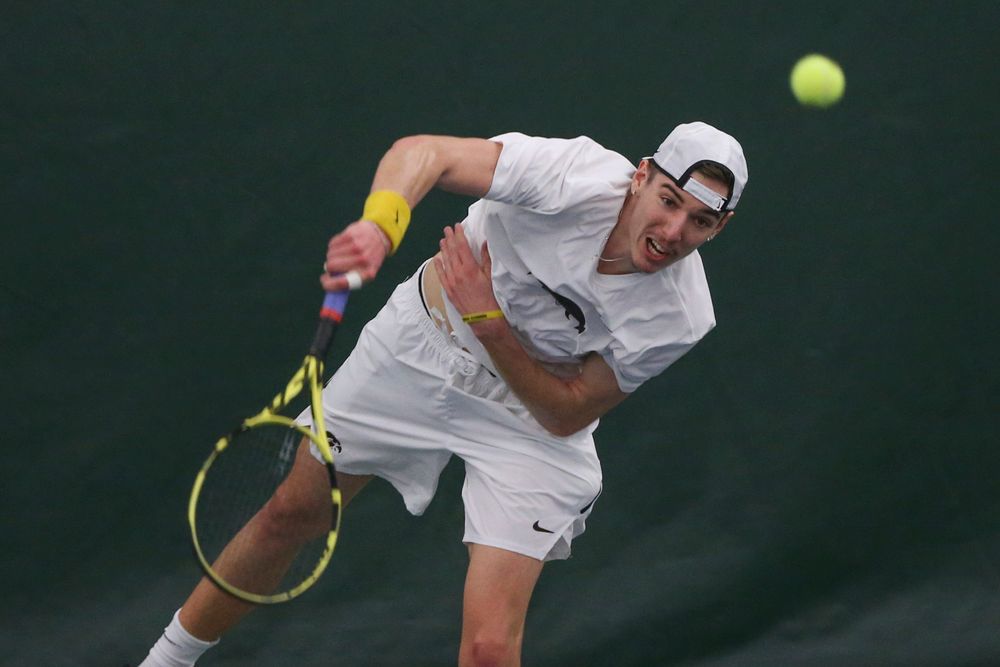 Iowa’s Nikita Snezhko serves the ball during the Iowa men’s tennis meet vs Nebraska on Sunday, March 1, 2020 at the Hawkeye Tennis and Recreation Complex. (Lily Smith/hawkeyesports.com)