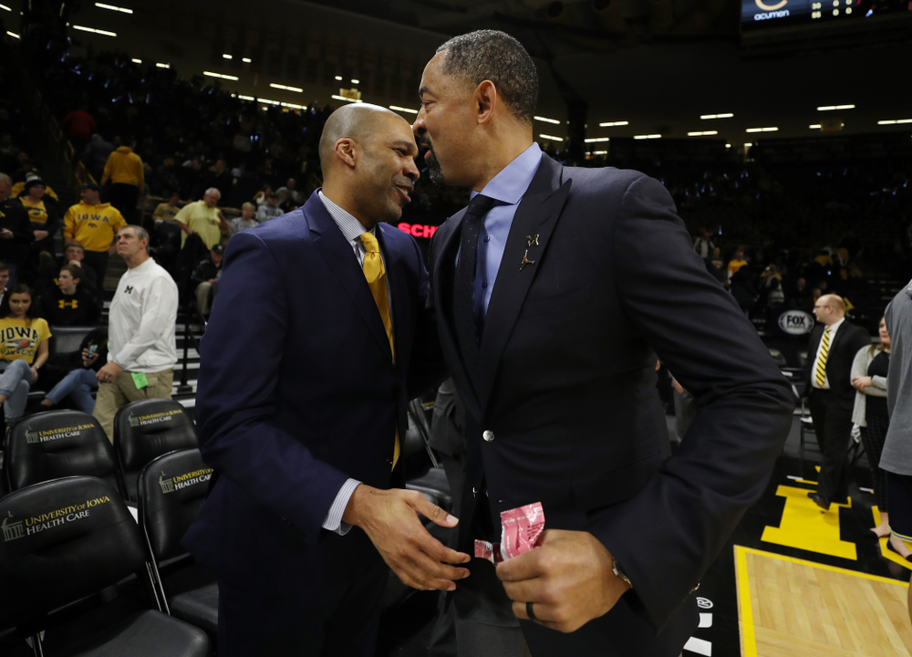 Iowa Hawkeyes assistant coach Billy Taylor and Michigan Wolverines head coach Juwan Howard Friday, January 17, 2020 at Carver-Hawkeye Arena. (Brian Ray/hawkeyesports.com)