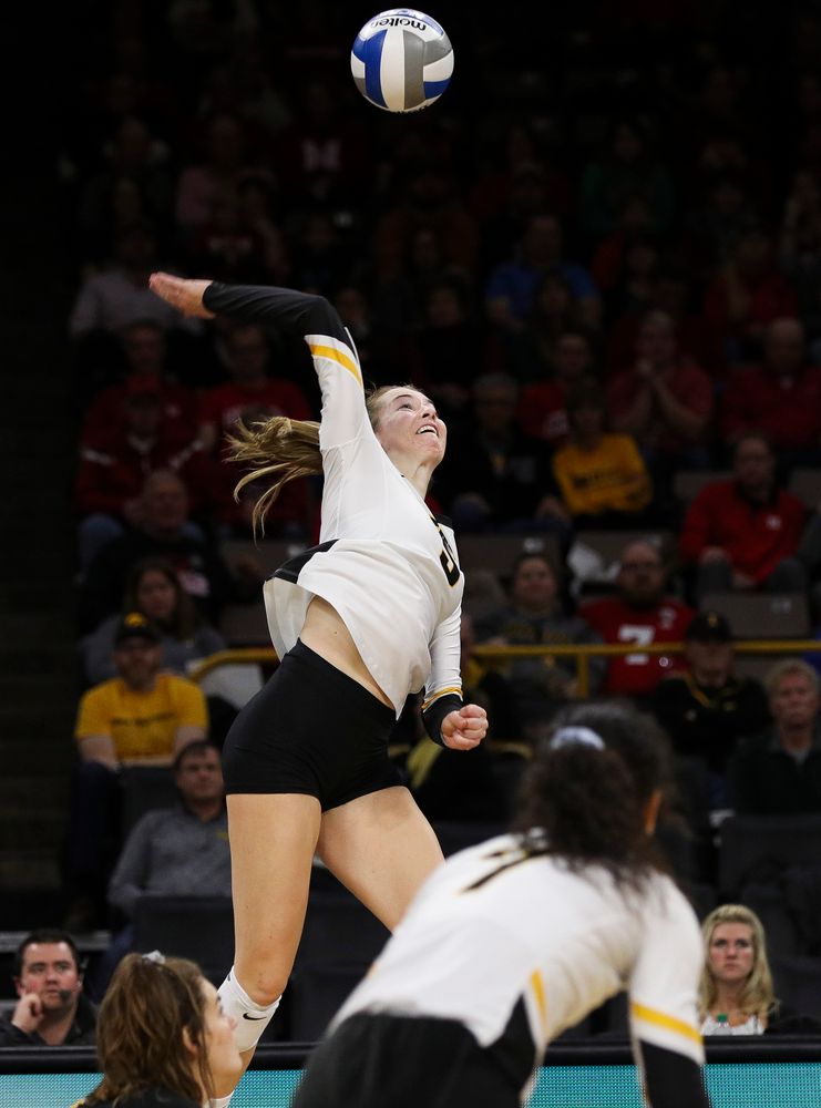 Iowa Hawkeyes outside hitter Meghan Buzzerio (5) spikes the ball during a match against Nebraska at Carver-Hawkeye Arena on November 7, 2018. (Tork Mason/hawkeyesports.com)