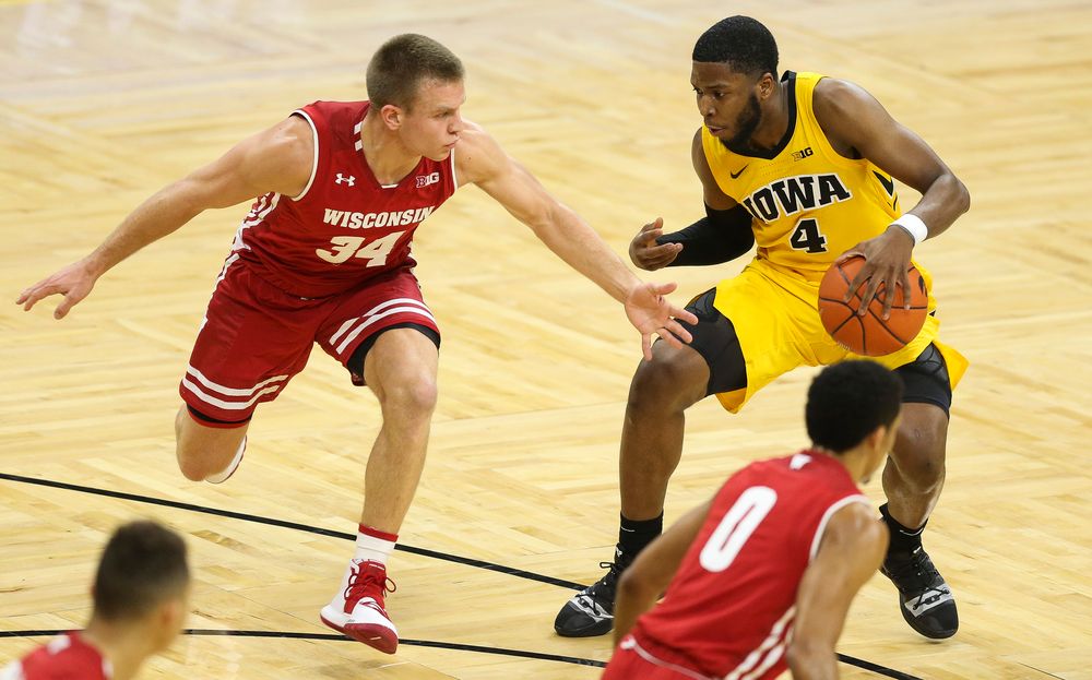 Iowa Hawkeyes guard Isaiah Moss (4) drives to the basket against Wisconsin on November 30, 2018 at Carver-Hawkeye Arena. (Tork Mason/hawkeyesports.com)