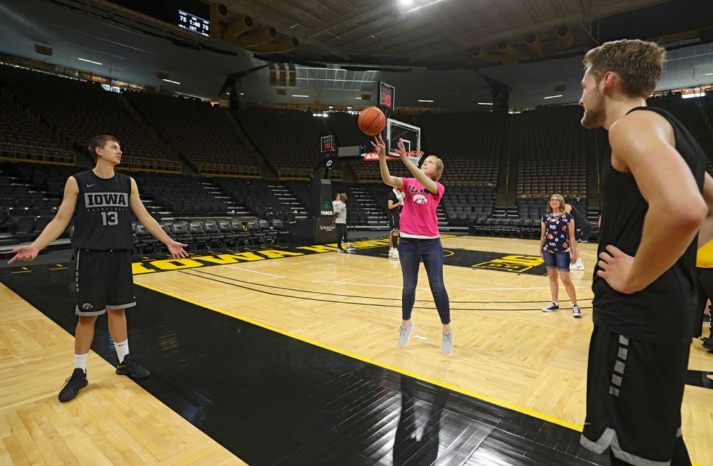 Iowa Hawkeyes guard Austin Ash (13) and forward Riley Till (20) shoot free throws with visitors from the University of Iowa Hospitals and Clinics Adolescent and Young Adult (AYA) Cancer Program after practice at Carver-Hawkeye Arena in Iowa City on Monday, Sep 30, 2019. (Stephen Mally/hawkeyesports.com)