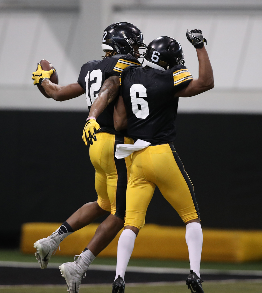 Iowa Hawkeyes wide receiver Brandon Smith (12) and wide receiver Ihmir Smith-Marsette (6) during preparation for the 2019 Outback Bowl Wednesday, December 19, 2018 at the Hansen Football Performance Center. (Brian Ray/hawkeyesports.com)