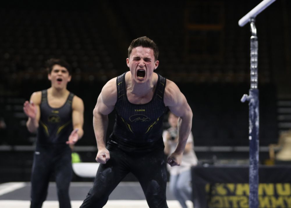 Iowa's Jake Brodarzon competes on the parallel bars against the Ohio State Buckeyes Saturday, March 16, 2019 at Carver-Hawkeye Arena. (Brian Ray/hawkeyesports.com)