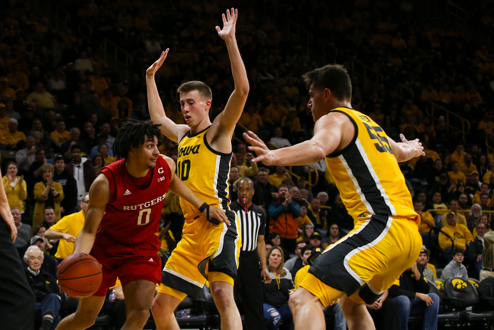 Iowa Hawkeyes guard Joe Wieskamp (10) and center Luka Garza (55) guard Rutgers’ Geo Baker during the Iowa men’s basketball game vs Rutgers on Wednesday, January 22, 2020 at Carver-Hawkeye Arena. (Lily Smith/hawkeyesports.com)