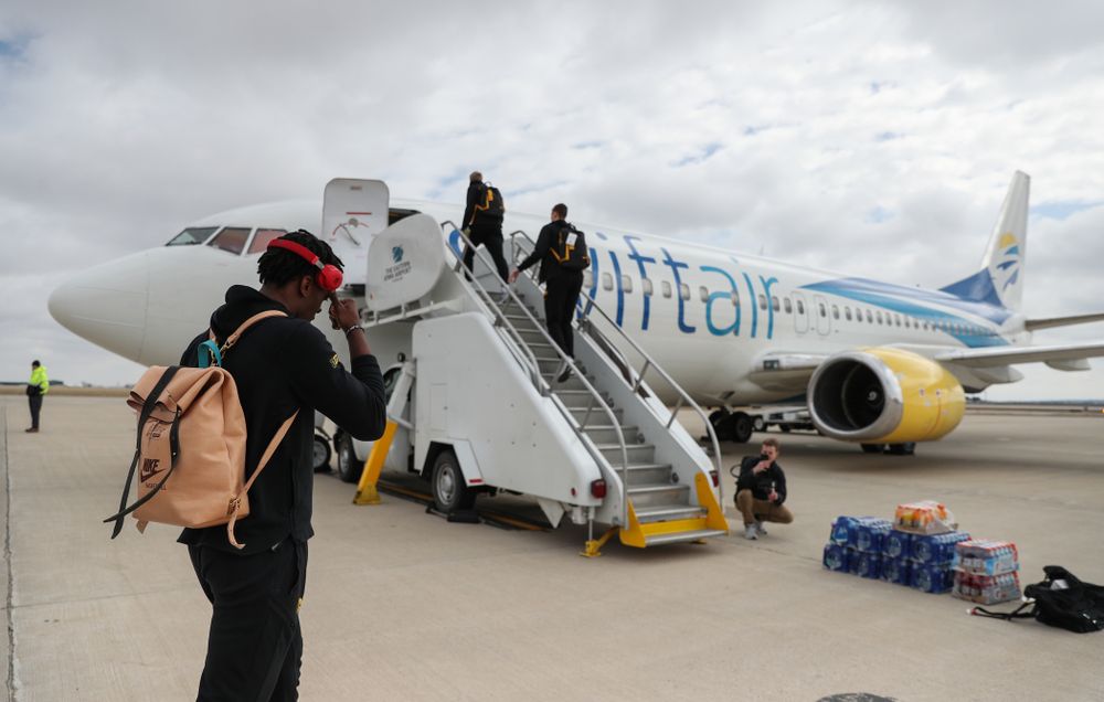 Iowa Hawkeyes forward Tyler Cook (25) boards a flight to Columbus for the first and second rounds of the 2019 NCAA Men's Basketball Tournament Wednesday, March 20, 2019 at the Eastern Iowa Airport. (Brian Ray/hawkeyesports.com)