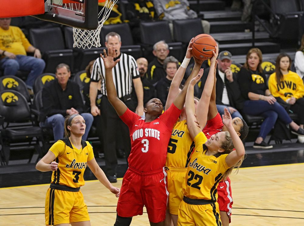 Iowa Hawkeyes forward Monika Czinano (25) and guard Kathleen Doyle (22) battle for a rebound during the second quarter of their game at Carver-Hawkeye Arena in Iowa City on Thursday, January 23, 2020. (Stephen Mally/hawkeyesports.com)