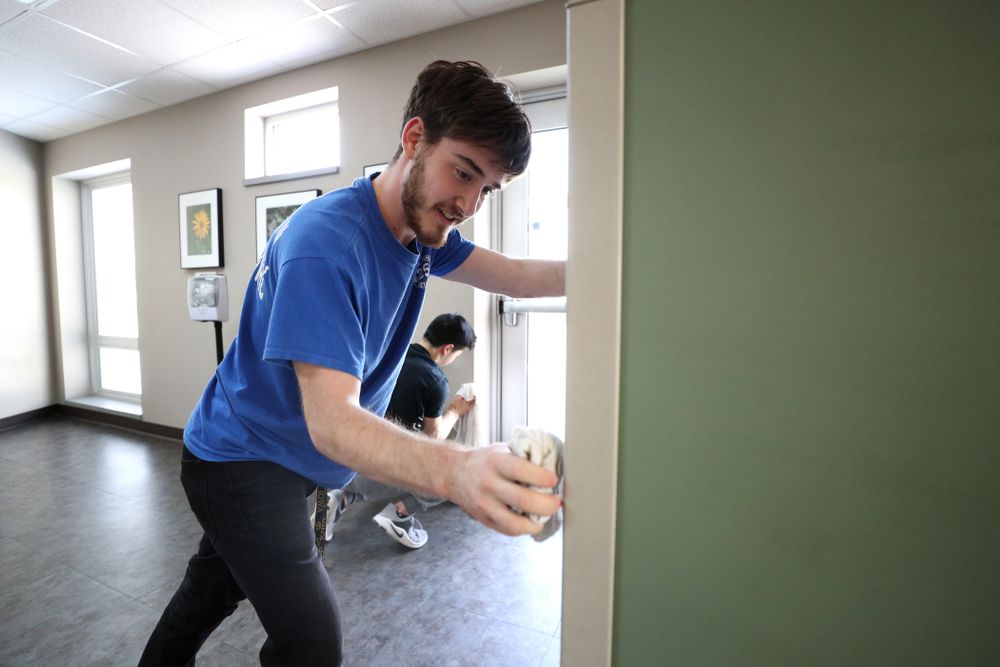 Members of the MenÕs Gymnastics team volunteer at CommUnity Crisis Services and Food Bank during the annual Iowa Athletics Day of Caring Sunday, April 28, 2019 in Iowa City. (Brian Ray/hawkeyesports.com)