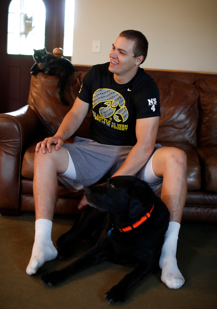 Iowa Hawkeyes quarterback Nathan Stanley (4) plays with his dog Onyx at his home Wednesday, May 30, 2018 in Menomonie, Wisc. (Brian Ray/hawkeyesports.com)