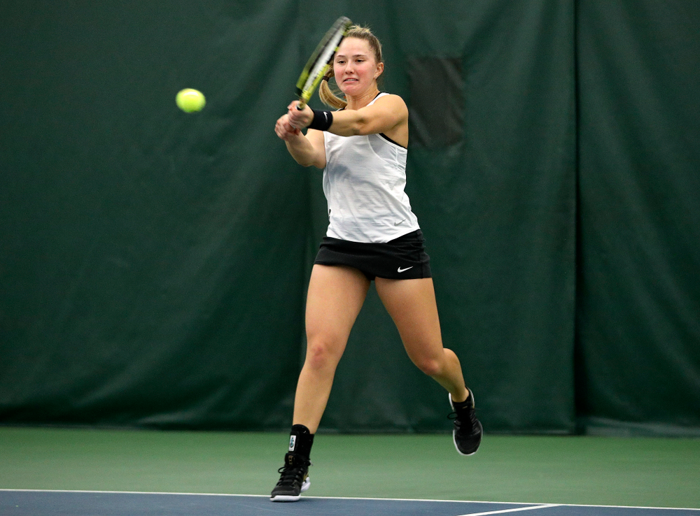 Iowa’s Danielle Burich returns a shot during her doubles match at the Hawkeye Tennis and Recreation Complex in Iowa City on Sunday, February 23, 2020. (Stephen Mally/hawkeyesports.com)