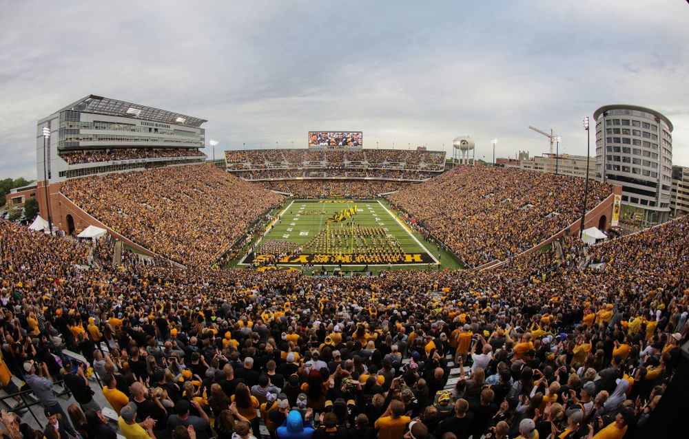 The Iowa Hawkeyes swarm onto the field for their game against the Miami RedHawks Saturday, August 31, 2019 at Kinnick Stadium in Iowa City. (Brian Ray/hawkeyesports.com)