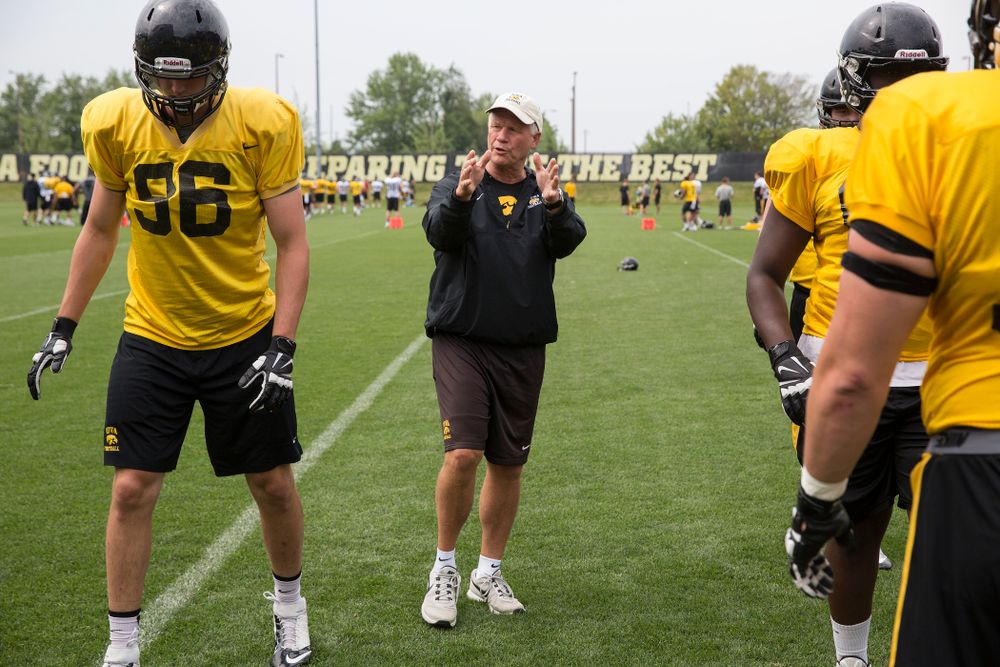 Iowa Hawkeyes Defensive Line coach Reese Morgan works with his unit during the team's eighth practice of camp Sunday, Aug. 10, 2014 at the Hayden Fry Football Complex in Iowa City. (Brian Ray/hawkeyesports.com)