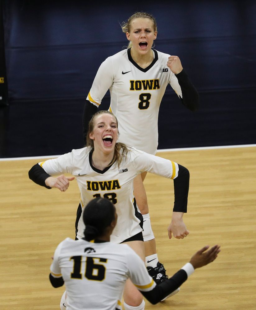 Iowa Hawkeyes right side hitter Reghan Coyle (8) and Iowa Hawkeyes middle blocker Hannah Clayton (18) celebrate after winning a point during a match against Rutgers at Carver-Hawkeye Arena on November 2, 2018. (Tork Mason/hawkeyesports.com)