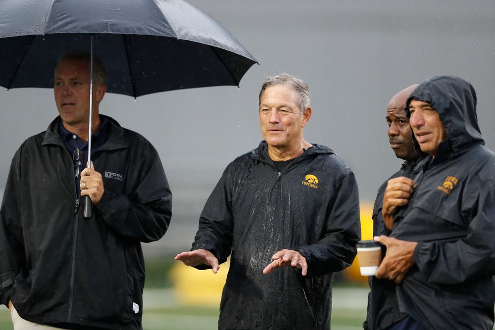 Iowa Hawkeyes head coach Kirk Ferentz talks with BTN's Gerry DiNardo, Howard Griffith, and Chuck Long during camp practice No. 15 Monday, August 20, 2018 at the Hansen Football Performance Center. (Brian Ray/hawkeyesports.com)