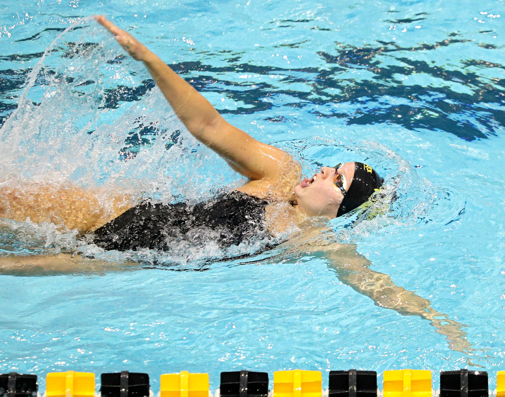 Iowa’s Julia Koluch swims the women’s 100-yard backstroke event during their meet against Michigan State and Northern Iowa at the Campus Recreation and Wellness Center in Iowa City on Friday, Oct 4, 2019. (Stephen Mally/hawkeyesports.com)