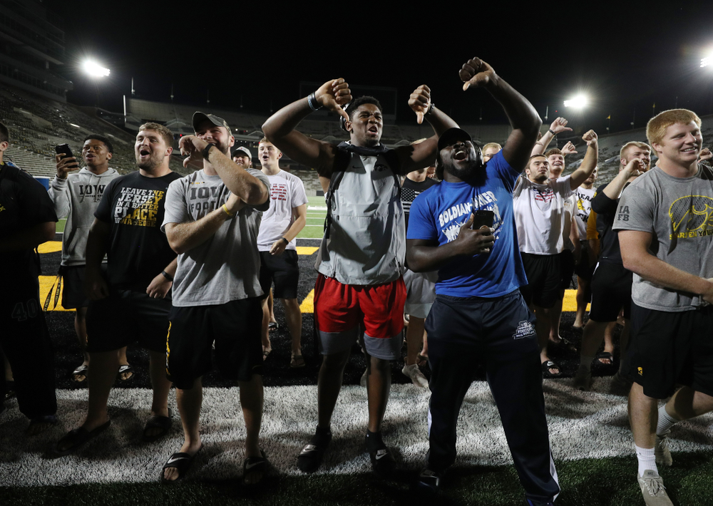 Members o the Iowa Football Team are not impressed by the new players first rendition of the ÒFight SongÓ Thursday, August 22, 2019 at Kinnick Stadium in Iowa City. (Brian Ray/hawkeyesports.com)