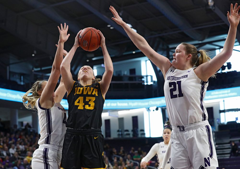 Iowa Hawkeyes forward Amanda Ollinger (43) makes a basket during the first quarter of their game at Welsh-Ryan Arena in Evanston, Ill. on Sunday, January 5, 2020. (Stephen Mally/hawkeyesports.com)