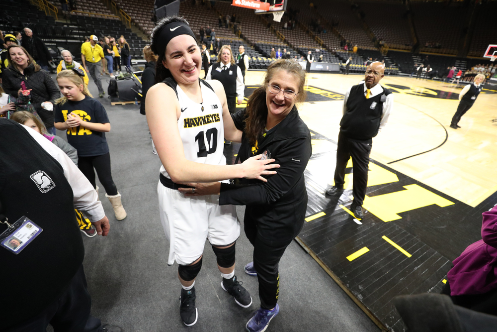 Iowa Hawkeyes forward Megan Gustafson (10) hugs her mother following their game against the Illinois Fighting Illini Thursday, February 14, 2019 at Carver-Hawkeye Arena. (Brian Ray/hawkeyesports.com)